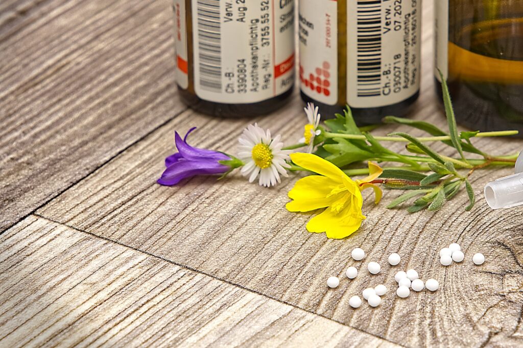 A bottle of medicine sitting on top of a wooden table