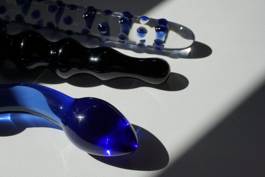 purple and black glass spoon pipe